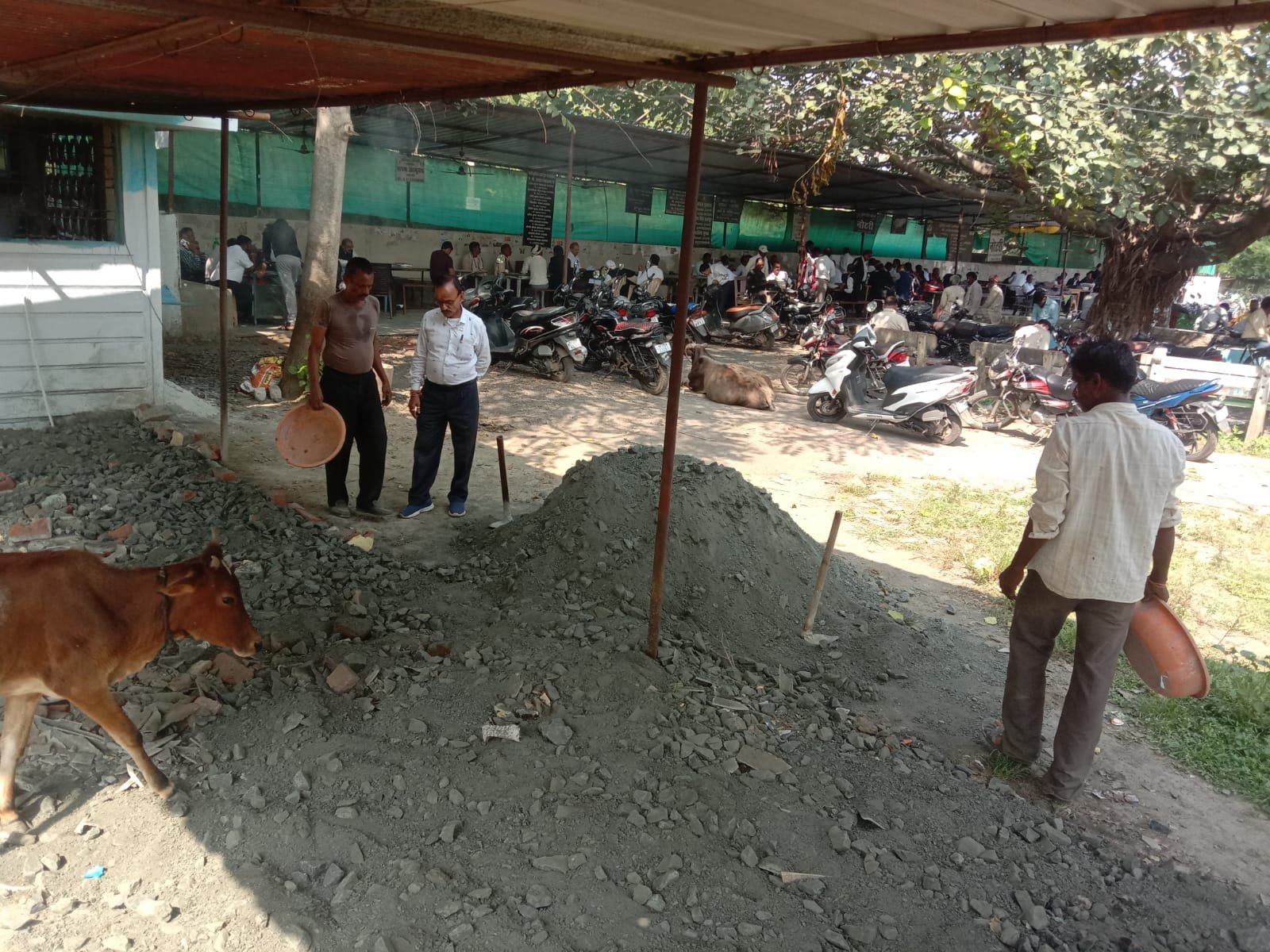 The land in front of the shed in the court premises is being levelled.