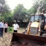 Cleaning after rain in PM Shri Kanya Shala, removal of grass and thorny bushes.