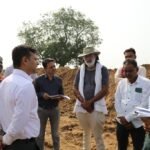 The commissioner inspected the canals in the tail area and saw the irrigation system.