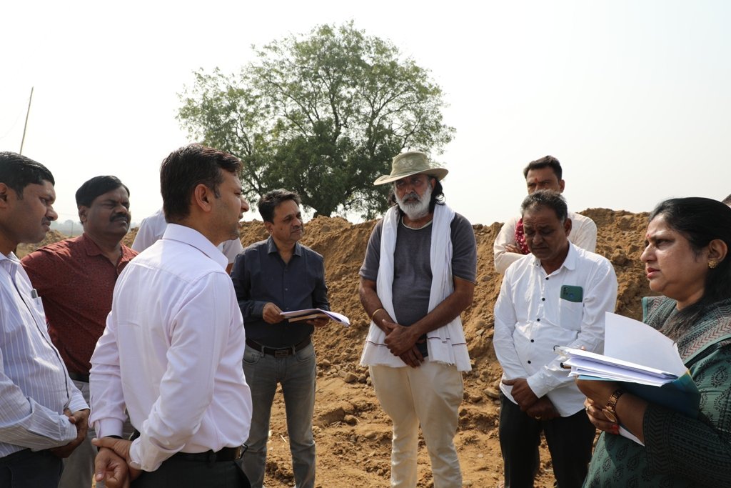 The commissioner inspected the canals in the tail area and saw the irrigation system.