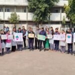 Students gave the message of awareness about AIDS by wearing red ribbon