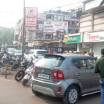 Despite the no-parking information board, four-wheelers are still parked at Jaistambh Chowk.