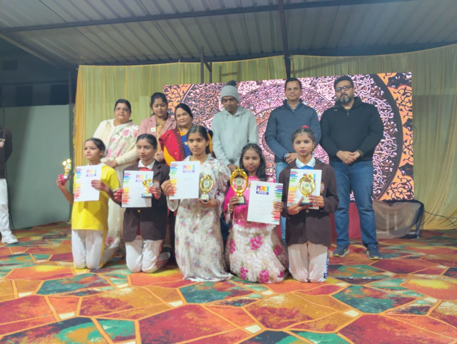 Prizes distributed to the winners of peace posters drawing competition in the school annual function