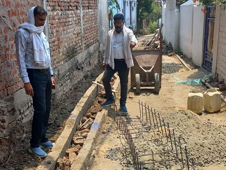 The chairman inspected the road and drain being built after 25 years in ward 8
