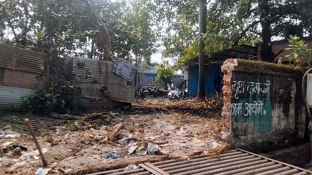 Security threat! A broken wall behind the parcel office is a gathering place for anti-social elements.