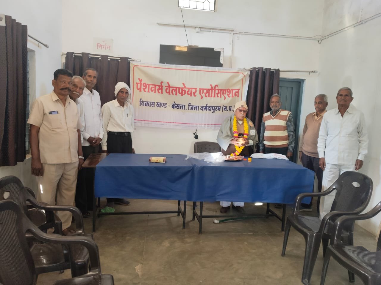 80-year-old senior member Uikey was honoured at the Pensioners Day felicitation ceremony.