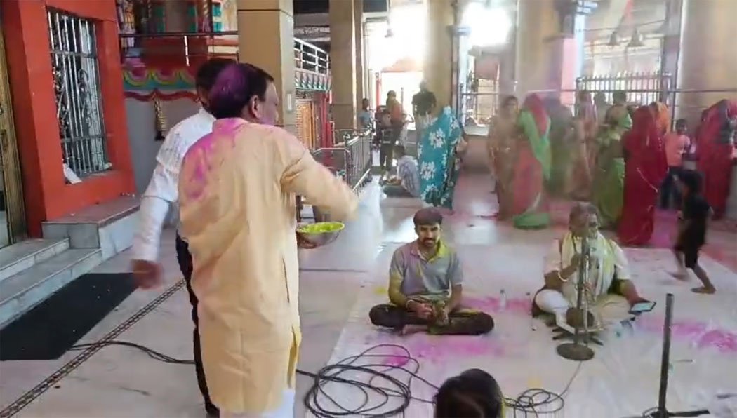 Devotees celebrated Holi with flowers and colours at Hanuman Dham temple, dancing to the tunes of Phag songs.