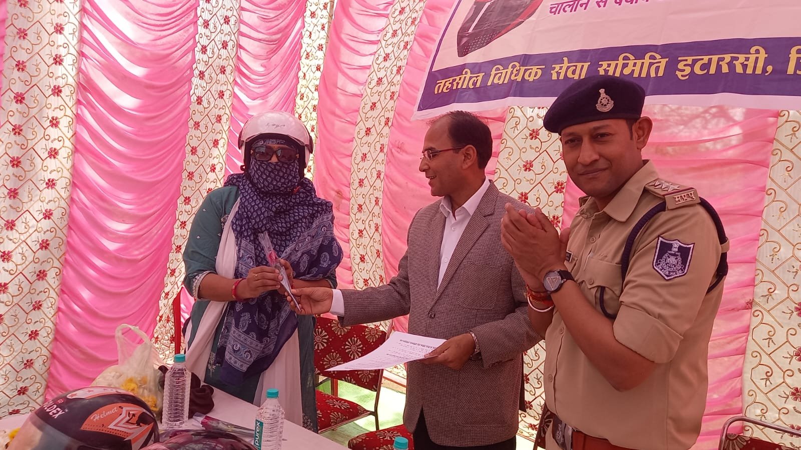 Traffic awareness at Gwal Baba Temple: ADJ honored those wearing helmets by giving them roses.